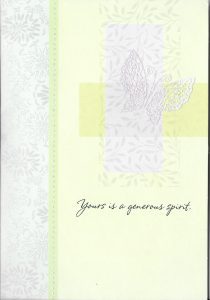 A card with a cross and leaves on it.
