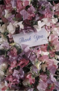 A thank you note is displayed on the flowers.