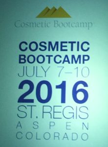 A green sign with the words cosmetic bootcamp on it.