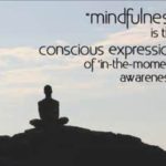 A person sitting on top of a hill with the words " mindfulness is the conscious expression of in-the moment awareness ".