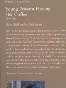 A close up of the back cover of her coffee