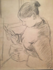 A pencil drawing of a boy holding something in his hands.
