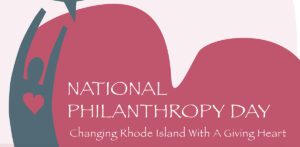 A pink background with the words national philanthropy day written in white.